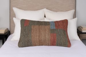 Amity home webb grande bolster in multi color   woven jute patchwork design