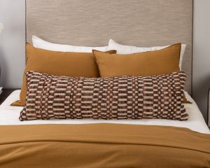 Amity home philips x long bolster in cognac   woven checkerboard texture