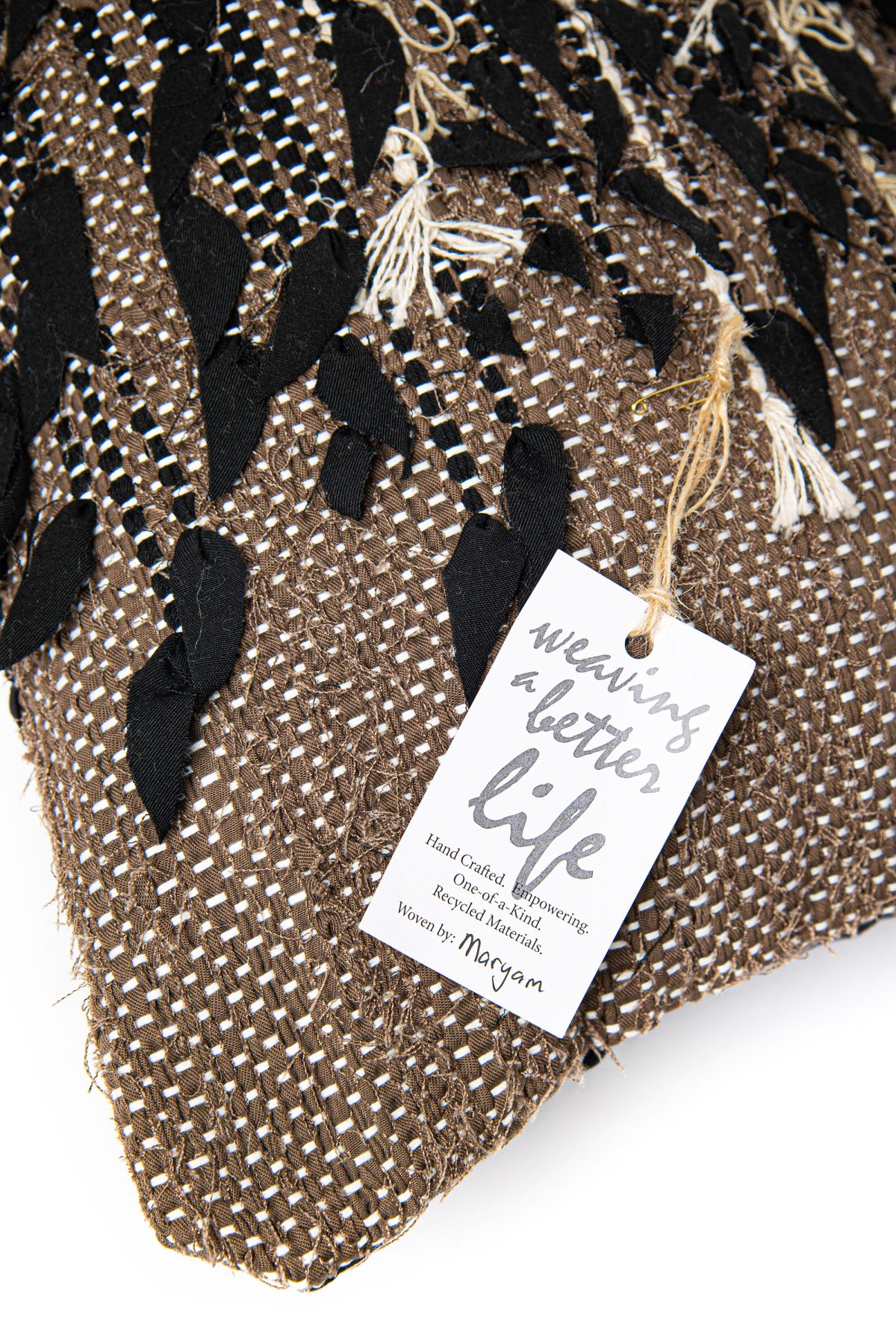 Amity home blakely bolster in bronze   appliqué fabric detail