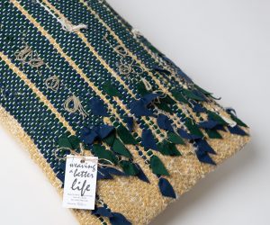 Amity home blakely bolster in maize   hand woven with fabric appliques