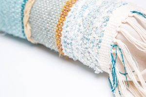 Amity home tallulah pencil bolster in aqua multi   artisanal woven texture