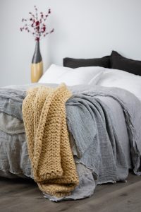 Amity home gage cable knit throw in ochre   chunky cable knit texture