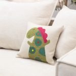 Amity home alligator wool felt pillow in cream   green alligator appliqué