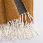 Amity home grant throw in ochre   slub weave texture