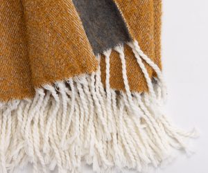 Amity home grant throw in ochre   slub weave texture