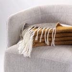 Amity home grant throw in ochre   white tassel fringe