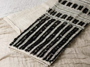 Amity home cole throw in black  natural   textured stripe weave