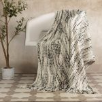 Amity home chase throw in ink   textured weave with fringe