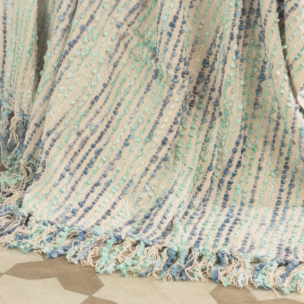 Amity home chase throw in peacock   bouclé striped texture