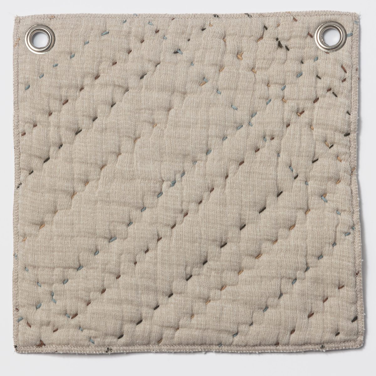 Amity home mendel quilt in earth   quilted with multi color dash stitches