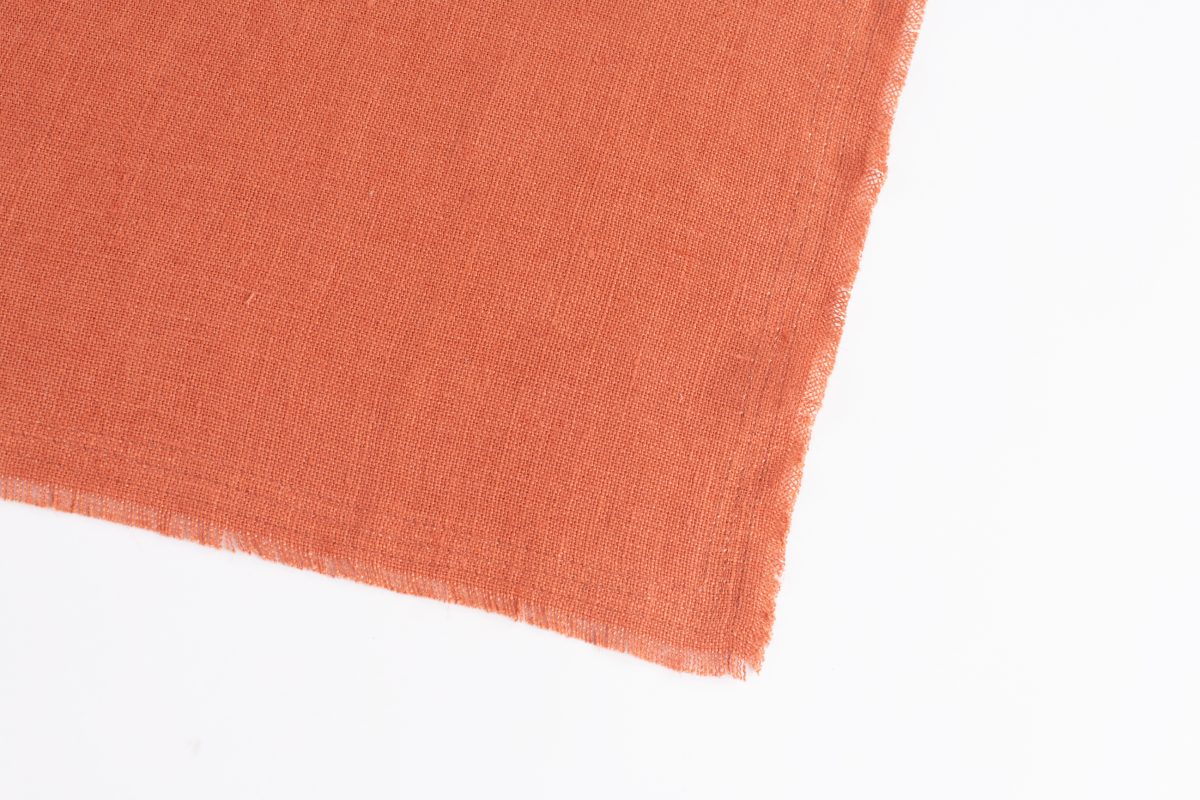 Amity home ranier linen table runner in burnt sienna   frayed edges