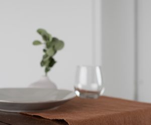 Amity home ranier linen table runner in saddle   raw edge detail