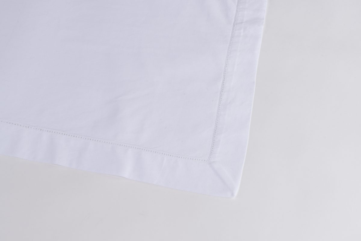 Amity home murano table runner in white   delicate stitched border