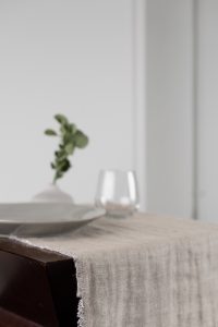 Amity home kent linen table runner in natural linen   frayed edges
