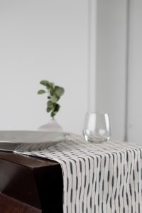 Amity home lana table runner in natural with black stripes   ikat pattern