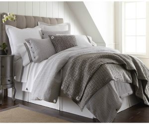 Amity home brayden grey stripes duvet cover on a bed styled with coordinating striped pillows and a textured grey quilt