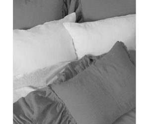 Amity home caprice duvet cover   neutral grey bedding with soft relaxed texture and ruffled edges styled on a bed