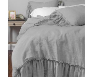 Amity home caprice duvet cover   platinum grey ruffled duvet cover and shams on a styled bed showing soft relaxed fabric