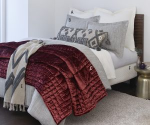 Amity home logan duvet cover in light grey featuring a subtle textured fabric styled on a luxury bed with layered bedding